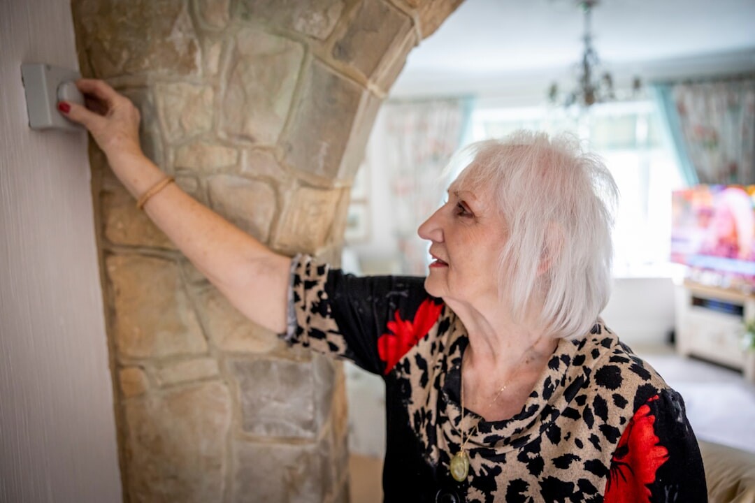 senior using emergency button